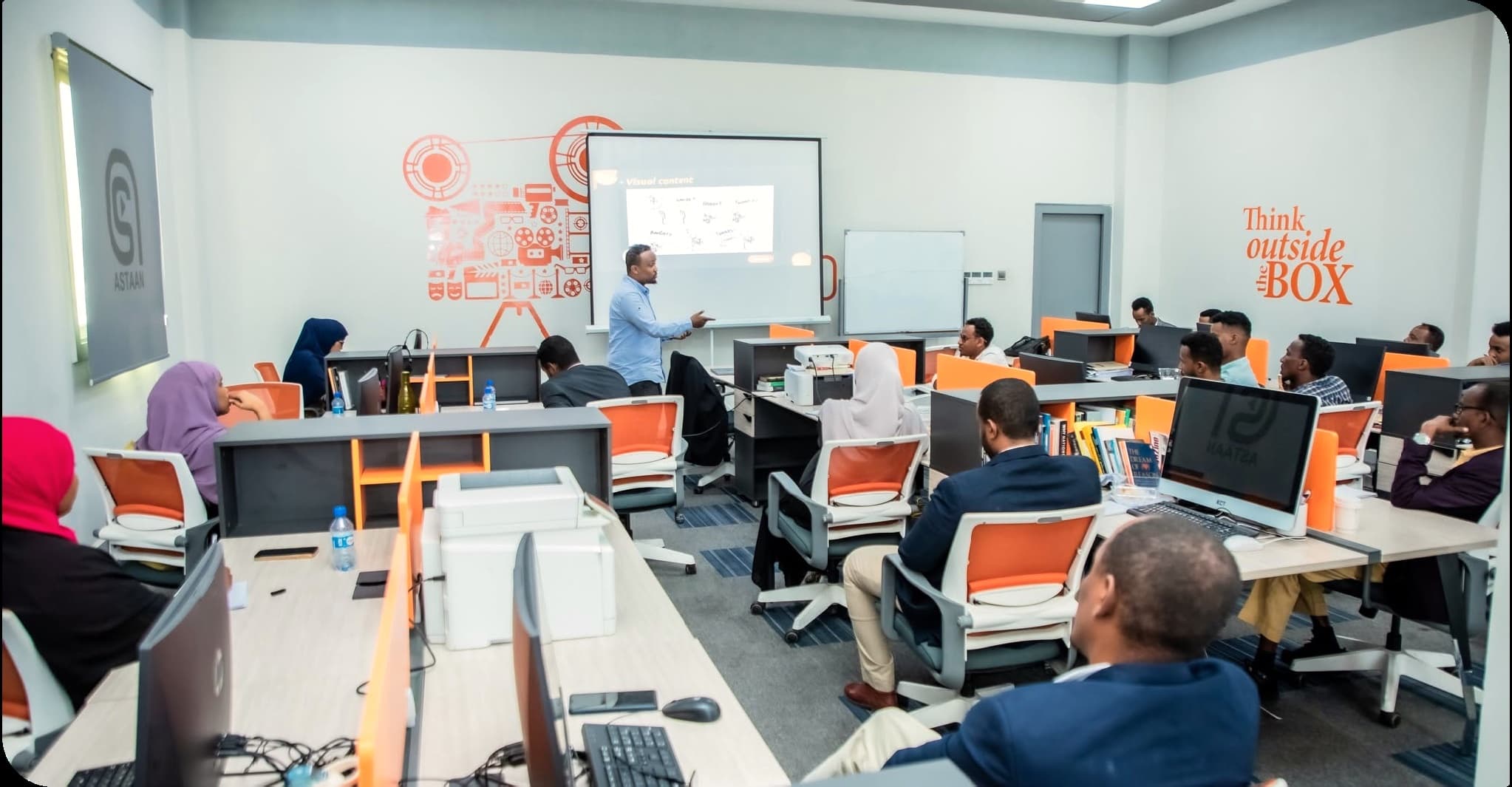 A training session in the Astaan Academy classroom, creators at their desks in Mogadishu