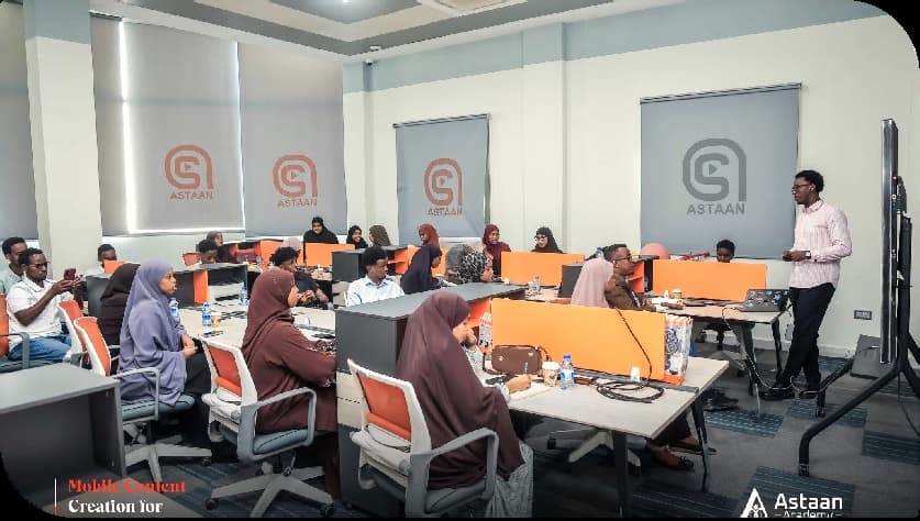 Trainees follow a mobile content creation session at Astaan Academy