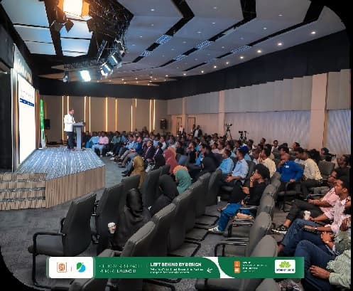 Wide view of the packed hall during the research report launch